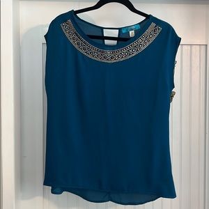 Blue blouse with beaded neckline and keyhole back